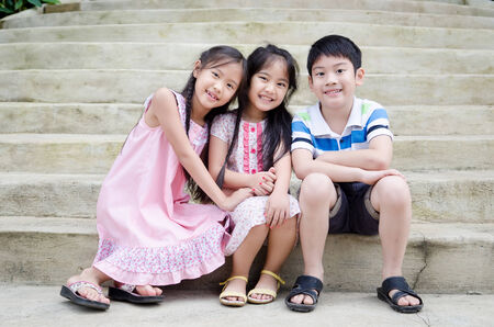 portrait of happy asian boy and girl having fun .の写真素材