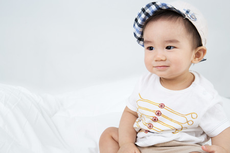Beautiful smiling asian cute baby,Little boy with hat
