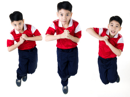 Group of Asian boy  jumping over white backgroundの写真素材