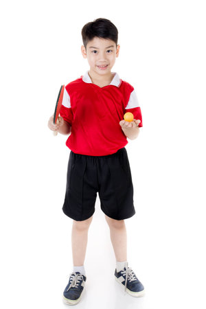 Portrait of Happy asian boy play table tennis isolated on white backgroundの写真素材
