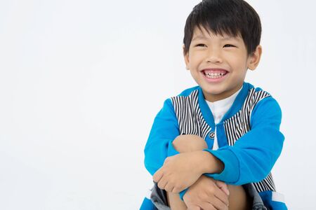 Portrait of Asian cute boy over on gray background ,Happy faceの写真素材