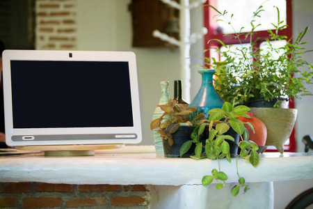 Stylish workplace in office with black screen on monitor for add your textの写真素材