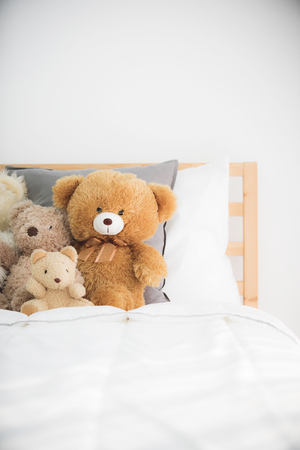 Cute teddy bears in kids white room.の写真素材