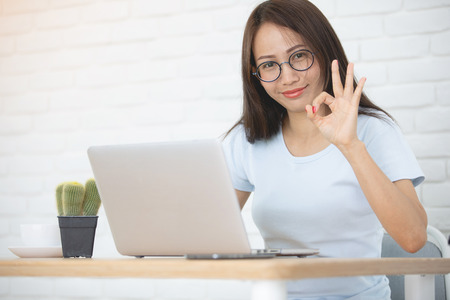 Young asian business woman working with personal laptop computer .の写真素材