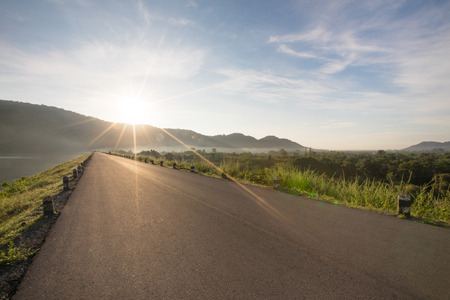 Asphalt road with reservoir on clearly blue sky and mountains with falre in the background Huaiprue...