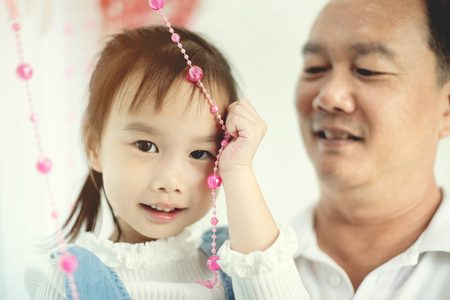 Happy asian family father enjoying with child, Family lifestyle at homeの写真素材