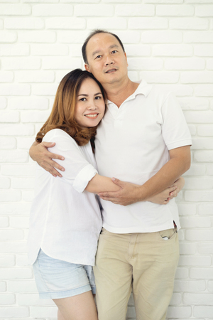 Portrait of happy asian married couple at home.の写真素材
