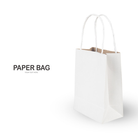 Creative layout made of White paper shopping bag isolated on white background . Paper bags with copy spaceの写真素材