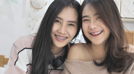 Asian beautiful girl looking at a camera with smile face, Portrait of young cute asian teenage .
