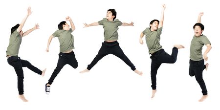 Portrait of happy little Asian child jumping isolated on white background.の写真素材