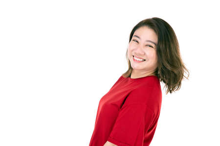 Portrait of middle age 40s Asian woman Isolated on white background , self-confident mature woman in a casual dress with a smiling faceの写真素材