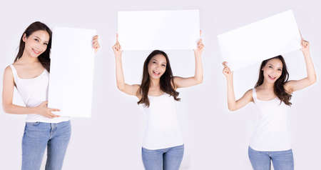 Asian woman show white board isolated on gray background