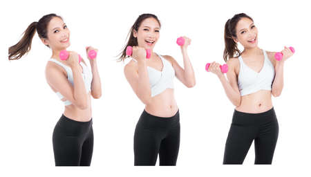 Portrait of asian pretty sporty woman holding weights looking camera with smileface ,isolated on white backgroundの写真素材
