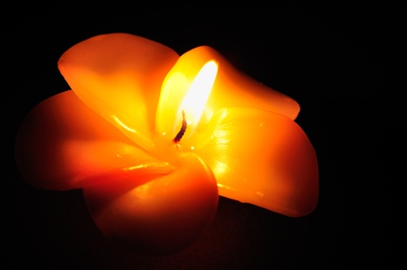 Burning candle in flower pattern の写真素材