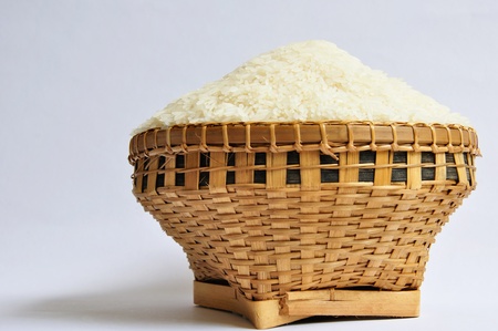 Raw rice with weaving basketの写真素材