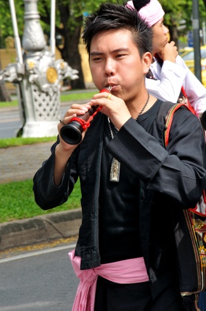 BANGKOK, THAILAND - OCTOBER 2: An unidentified person plays in a Traditional Thai music show during a traditional merit parade of people from the northern territory of Thailand, October 2, 2011 in Bangkok, Thailand.のeditorial素材