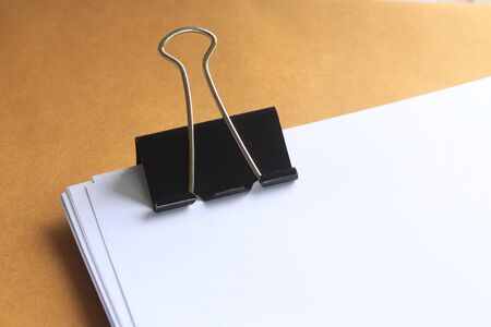 white paper note  clipping on yellow background.の写真素材