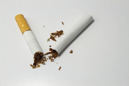 Broken cigarette isolated on white background