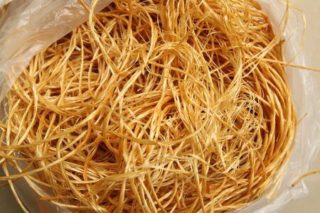 yellow thread in plastic bag
