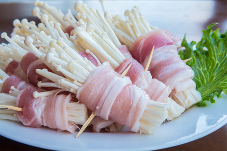 And mushrooms wrapped in bacon and then grilled or fried の写真素材