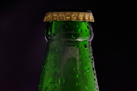 Cold Beer Bottle in the Dark Lightの写真素材