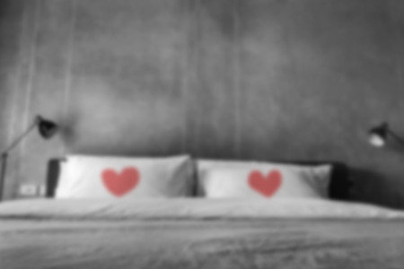 Blurred of Bed with Couple Pillow and Lamp in Black and White Color ,divorce or Love sadness conceptの写真素材