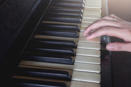Film vintage tone, Pianist use hand to play old piano