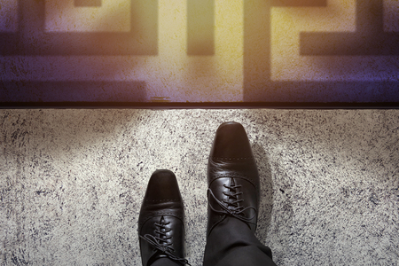 Challenge Concept, Top view of Businessman in Black business formal oxford shoes steps into mazeの写真素材