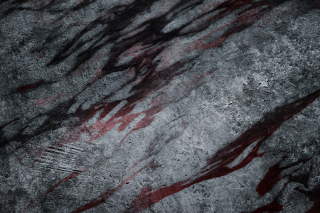 Horror abstract texture background with stain of dry blood on grunge cement concrete wallの写真素材