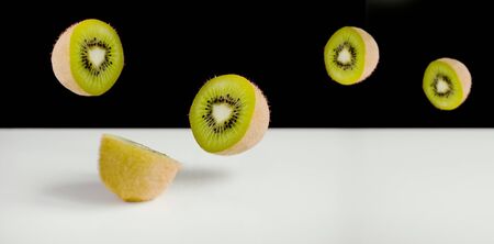 Kiwi Fruit Sliced and Flyingの写真素材