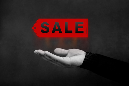 Sale and Promotional Concept, Hand opened to present a sale Tagの写真素材