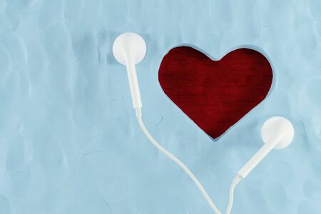 Love and Valentines Day Concept. Listening your Heart. Present by Heart Shape and Music Headphoneの写真素材