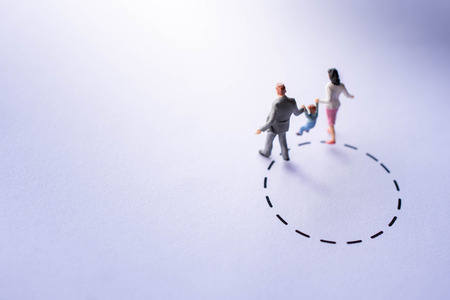 Comfort Zone for Kids Concept. present by Miniature Figure Happy Family Walking outside a Bound. Parent Supporting their Child to make a Differentの写真素材