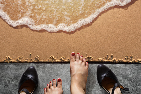 Work Life Balance Concept, Business Woman take off her Working Shoes on the Concrete Floor in front of Sand for Walk into the Sea Beach. Top Viewの写真素材