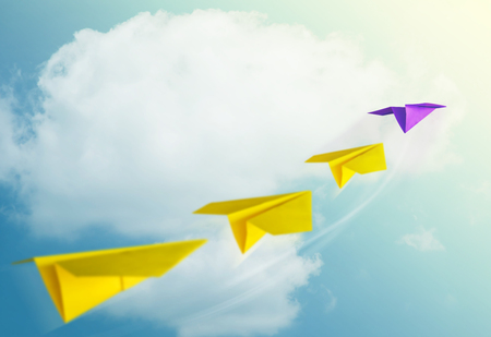 Leadership Concept. Unique Paper Plane Leading the Team into the Sky for Goals and Success in Businessの写真素材