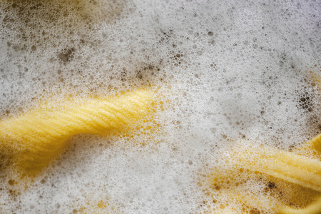 Closeup image of Cloth in the Basin with Foam Bubble. Cleaning and Washing Conceptの写真素材