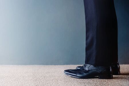 Start Concept. Low Section of Businessman on Formal Business Dress Get Ready to Moving Forward. Cropped Image with Copy Space. Side Viewの写真素材