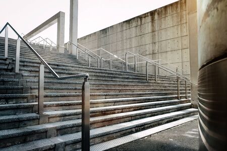 Empty Modern Cement Staircase in City with Morning Sun Light. Urban Background. Wide Shotの写真素材