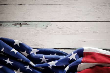 USA Flag Lying on Vintage Weathered Wooden Background. American Symbolic. 4th of July or Memorial Day of United States. Copy Space for Textの写真素材