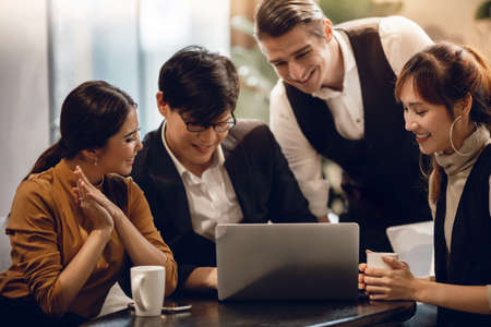 Working Together Concept. Group of Diversity Business People Working on Laptop in Office. Happy...