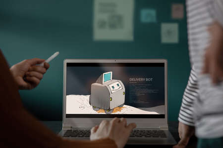 Working Together Concept. Small Startup Business Teamwork , Product Designer Working on Laptop. ...