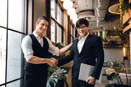 Happy Diversity Business People making Handshake Greeting. Partnership or Teamwork, Rewarding Recognition Conceptの写真素材