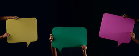 Colorful Blank Speech Bubble. Protest or Freedom to Speak Concept. Group of People Raised up Empty Speech Paperの写真素材