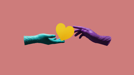 Love and Relationship during Coronavirus Concept. Valentines Day. Two Hands with Medical Glove giving a Heart Symbol. floating over Colorful Pop Color backgroundの写真素材