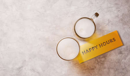 Happy Hours, Two Glass of Beer on Table. Couple or Two Friends Drinking Beer Concept.Hangout or Celebrate in Restaurant and Bar. Top Viewの写真素材