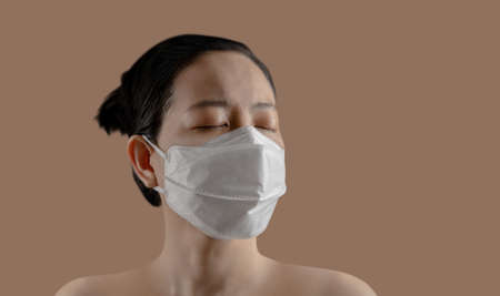 Positive Mindful or Air Pollution Situation. Mental Health Concept. Headshot of Asian Woman wearing...