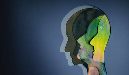 Mental Health Concept. Bipolar Disorder Person. Layers of Paper Cut as Human Head presenting Different of Emotionsの写真素材