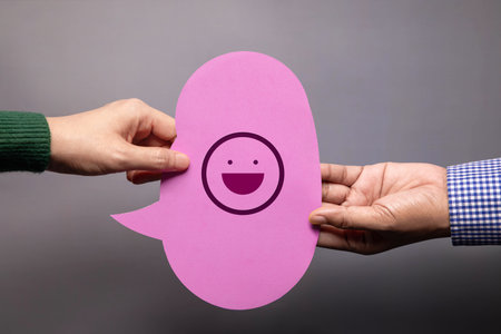Customer Experience Concept. Happy Client giving a Smiling Emoticon to a Businessman. Feedback on Bubble Speech Card. Positive Review. Satisfaction Surveyの写真素材