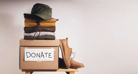 Clothes Donation, Renewable Concept.Box of Use Old Cloth. Preparing Garment at Home before Donateの写真素材