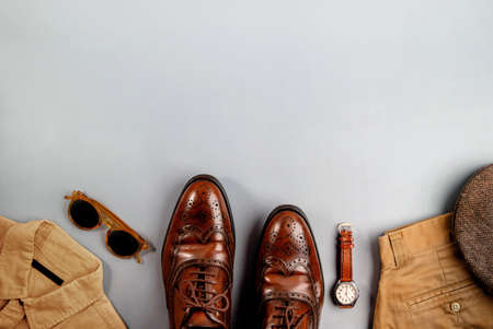 Men Clothes, Father Day Concept. Vintage Style. Flat Lay on Light Grey Background.Included Wingtips Dress Shoes, Hand Watch, Flat Cap Hat, Shirt, Pant and Sunglasses . Stylish Men. Top Viewの写真素材